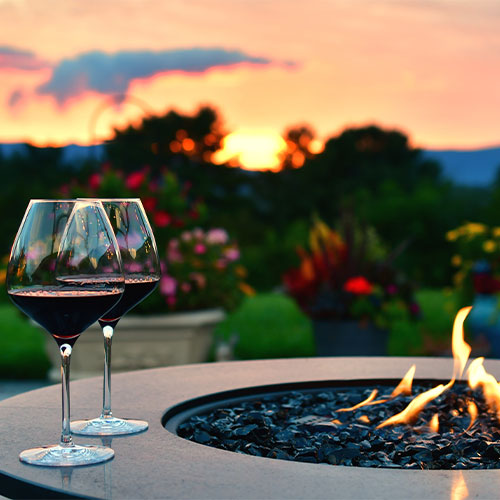 Family enjoying a meal in a newly completed custom outdoor living space
