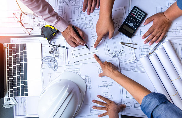 Construction team planning gas and electric utilities for a backyard